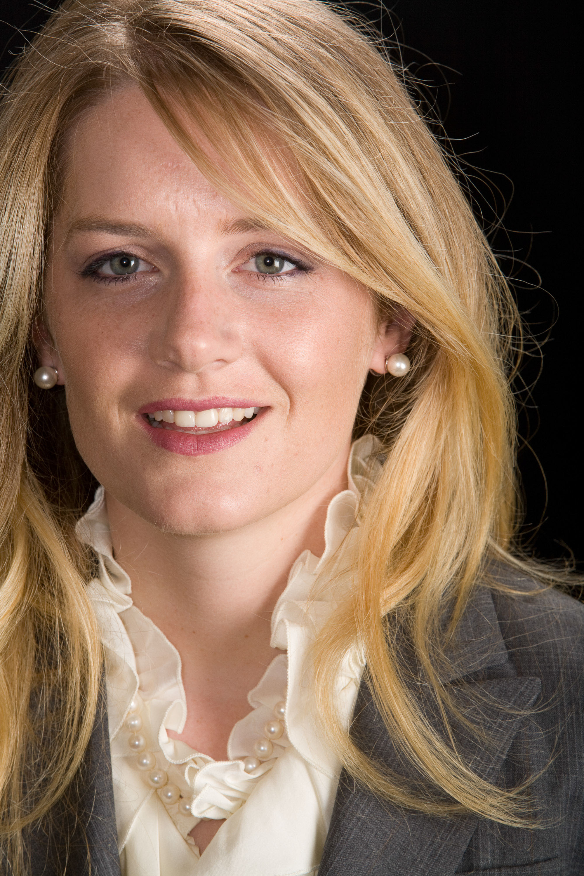 A simple, direct and powerful studio portrait of a blonde business woman