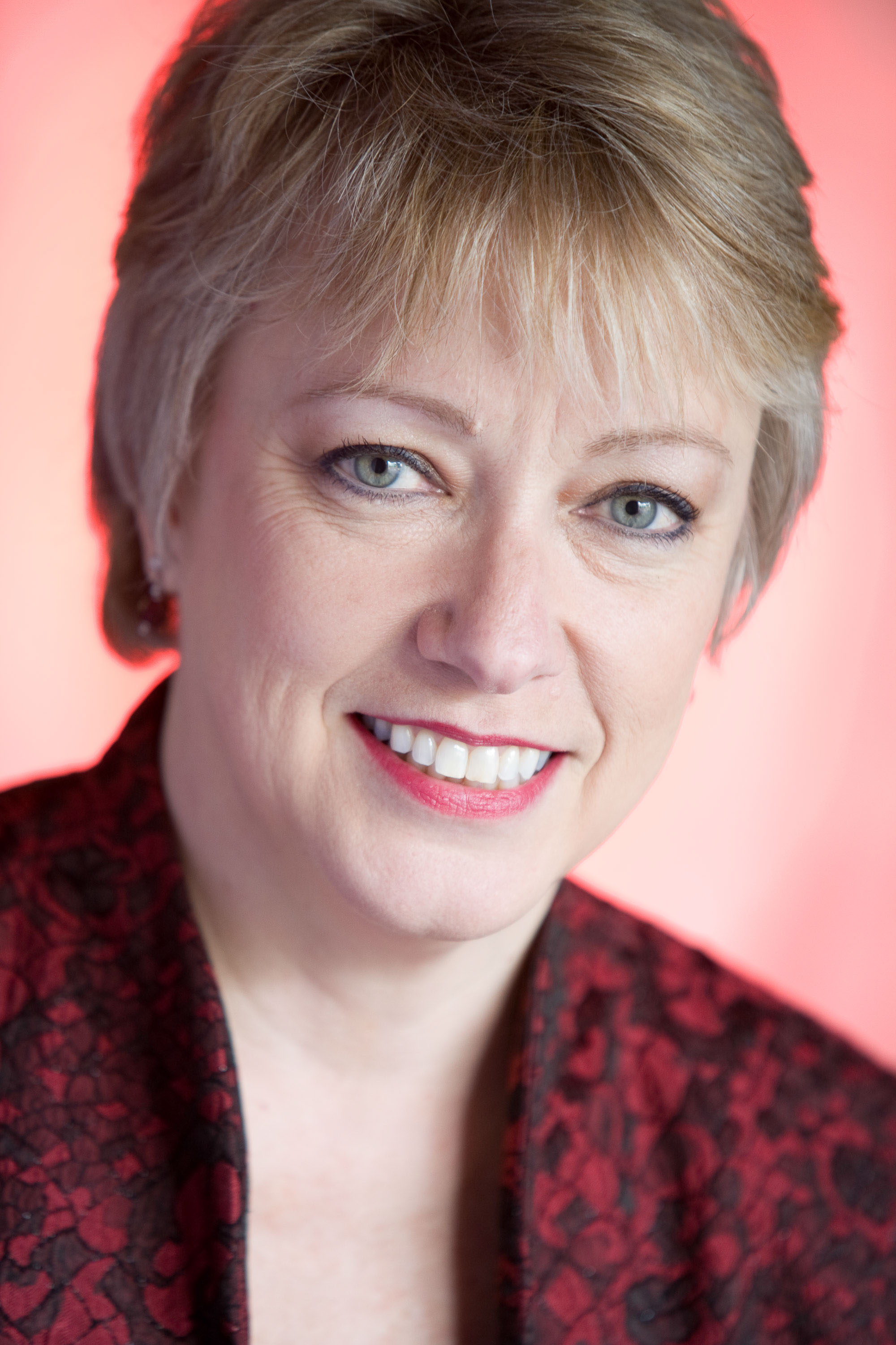 A studio portrait in soft pinks