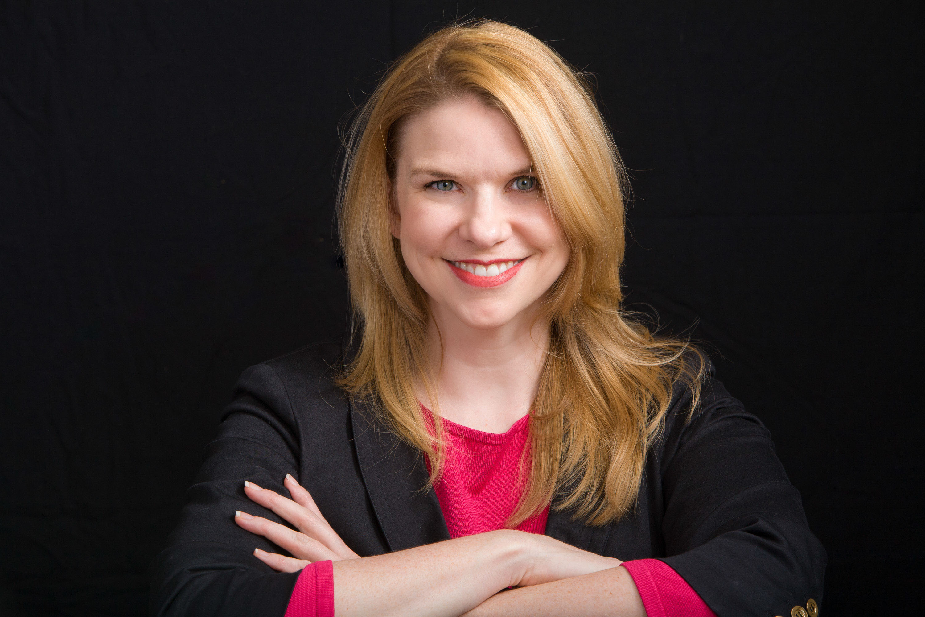 Studio portrait in black and magenta of business coach Dori Etter