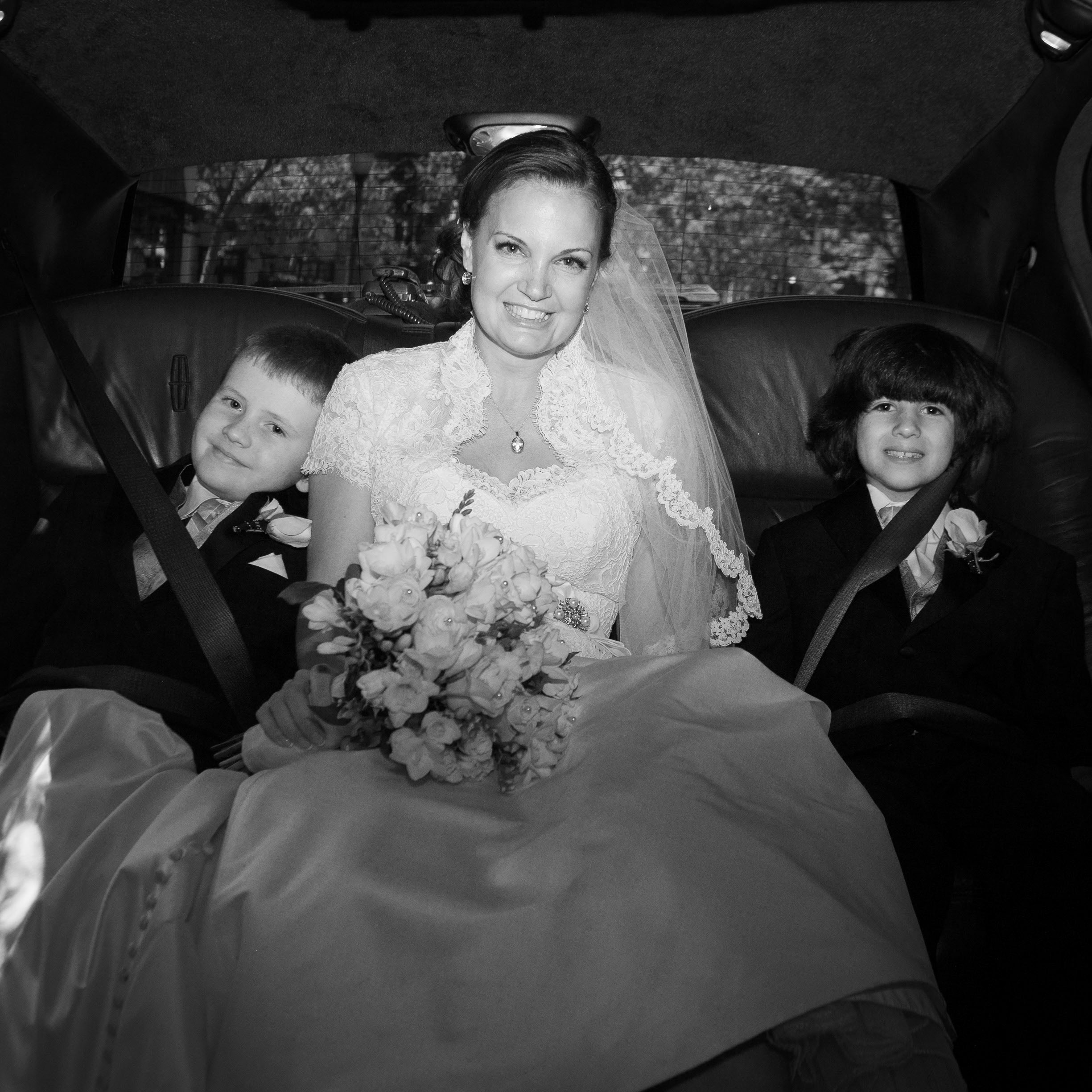 Kirsten rides to the church in a limo with two young companions, at the Holy Cross Greek Orthodox Church in Belmont