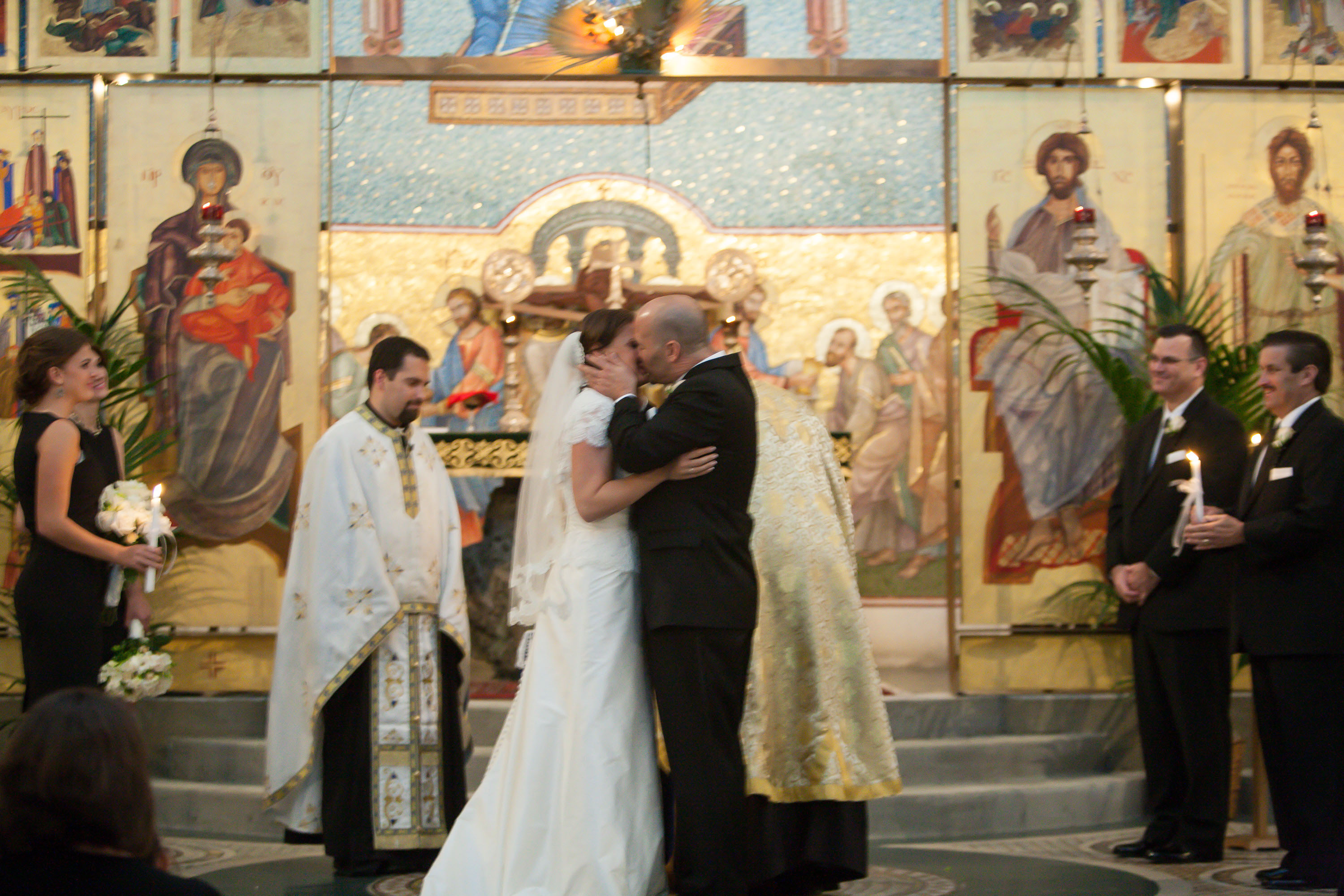 A wedding kiss at the Holy Cross Greek Orthodox Church in Belmont