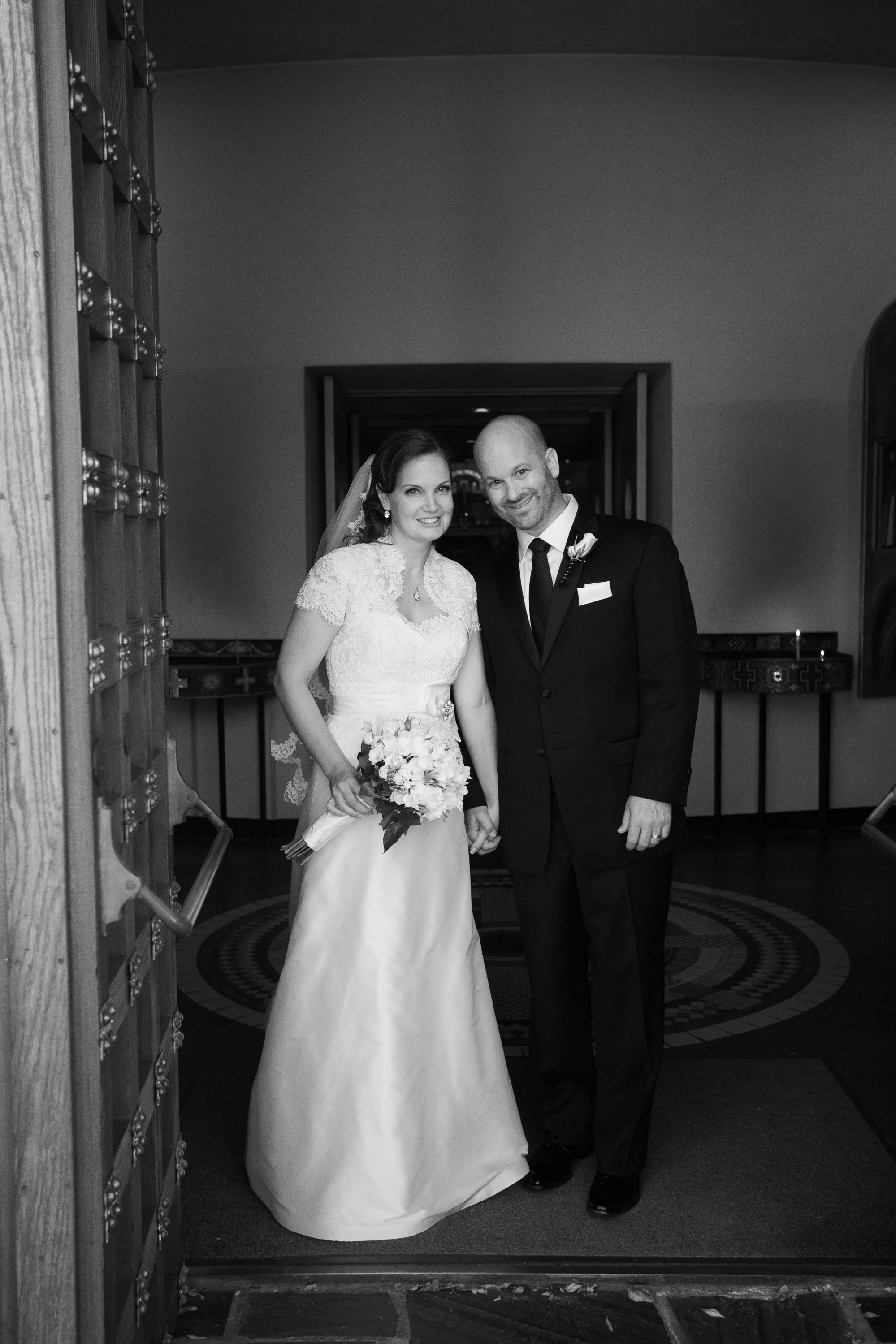 The bride and groom emerging from the church, at the Holy Cross Greek Orthodox Church in Belmont