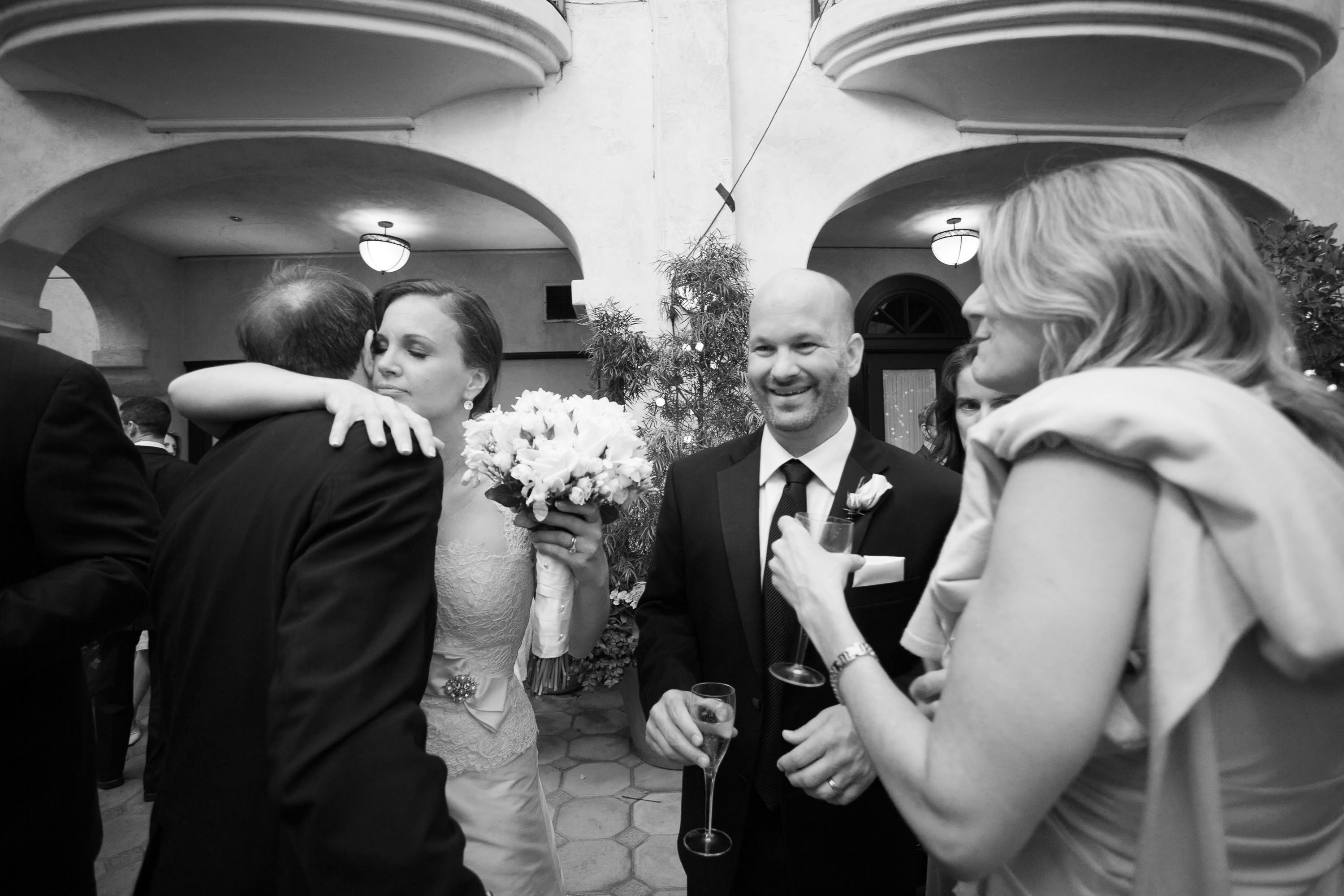The bride and groom greet their guests  at the Garden Court Hotel in Palo Alto