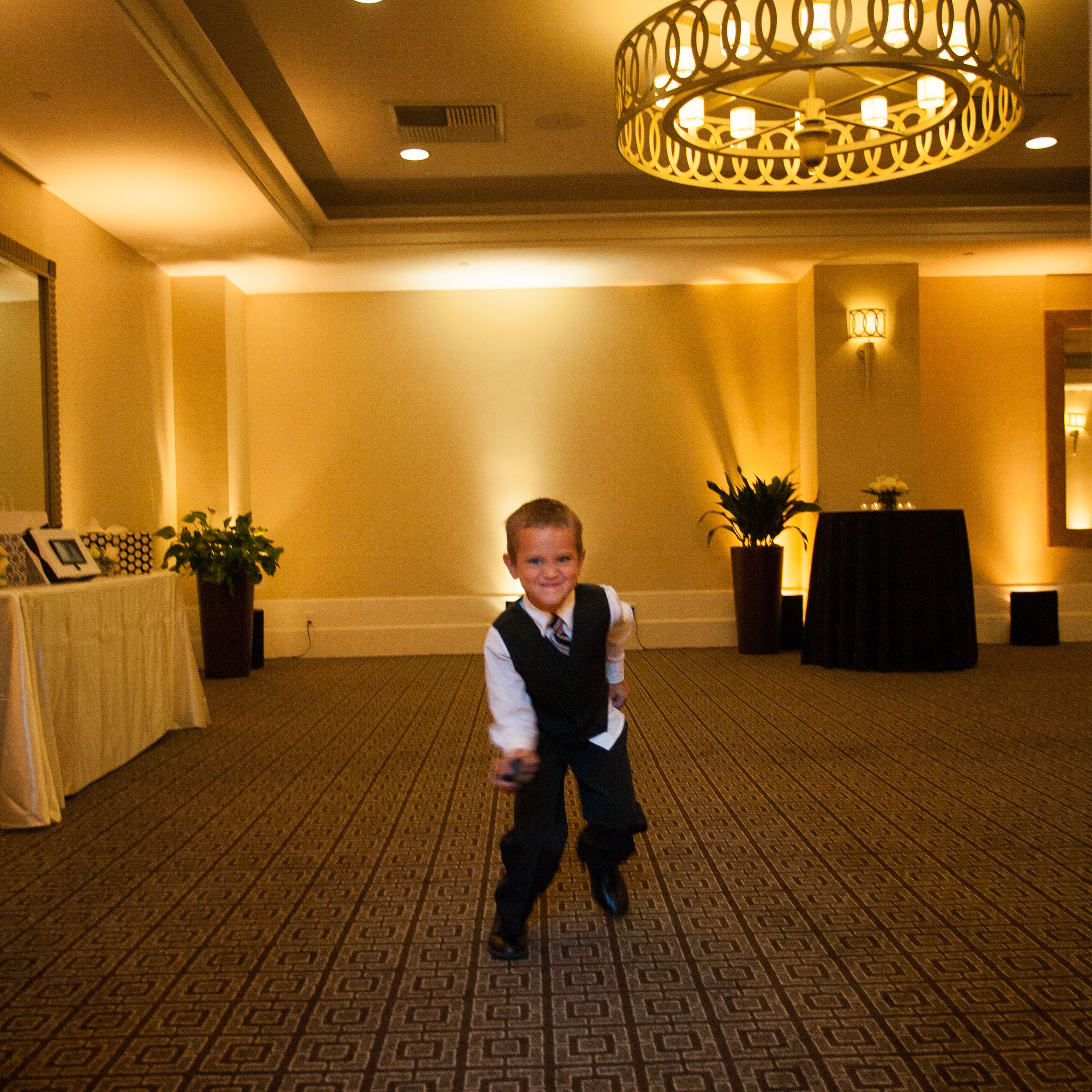A little boy dances  at the Garden Court Hotel in Palo Alto