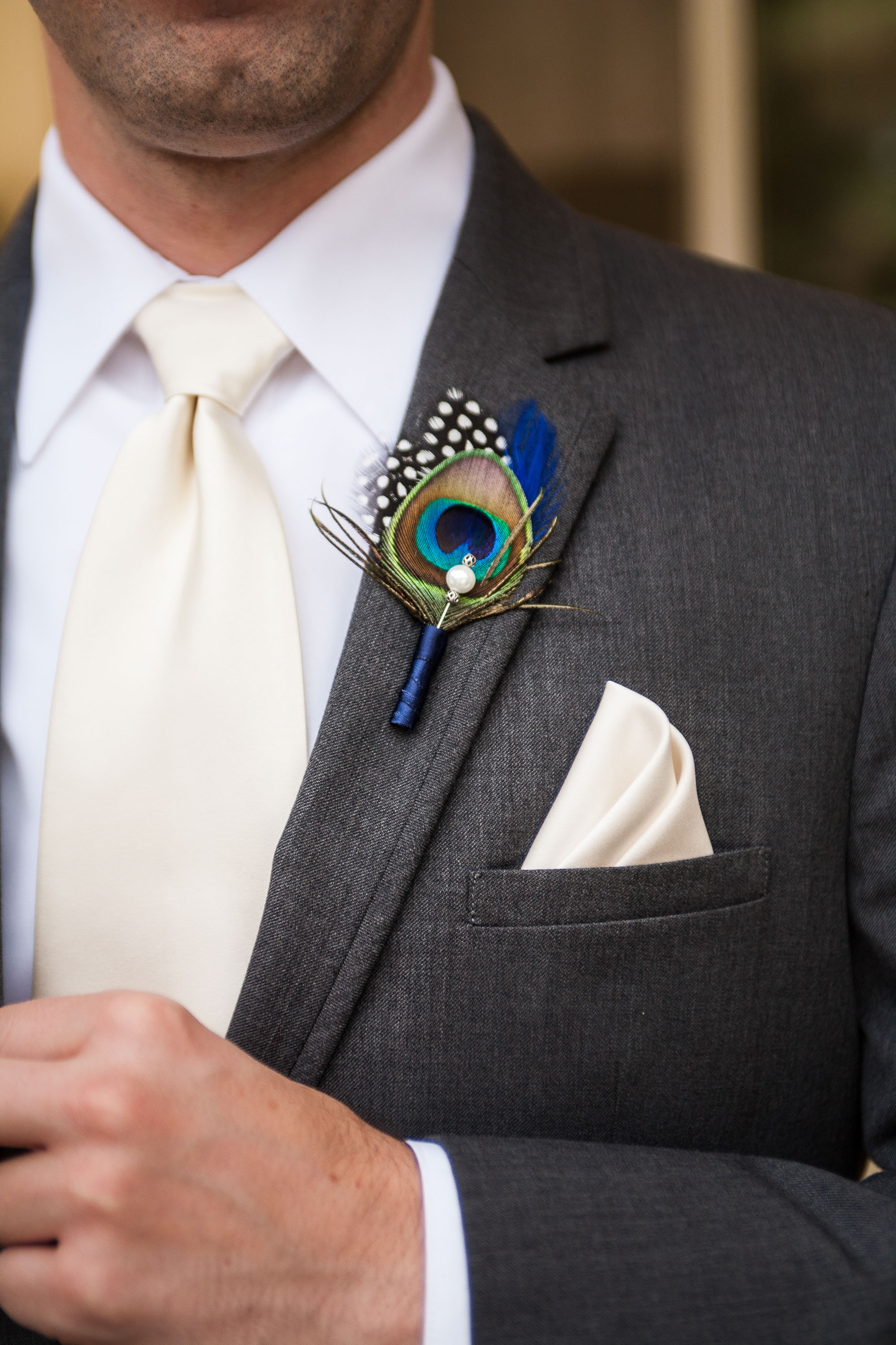 Kevin's matching peacock feather lapel pin