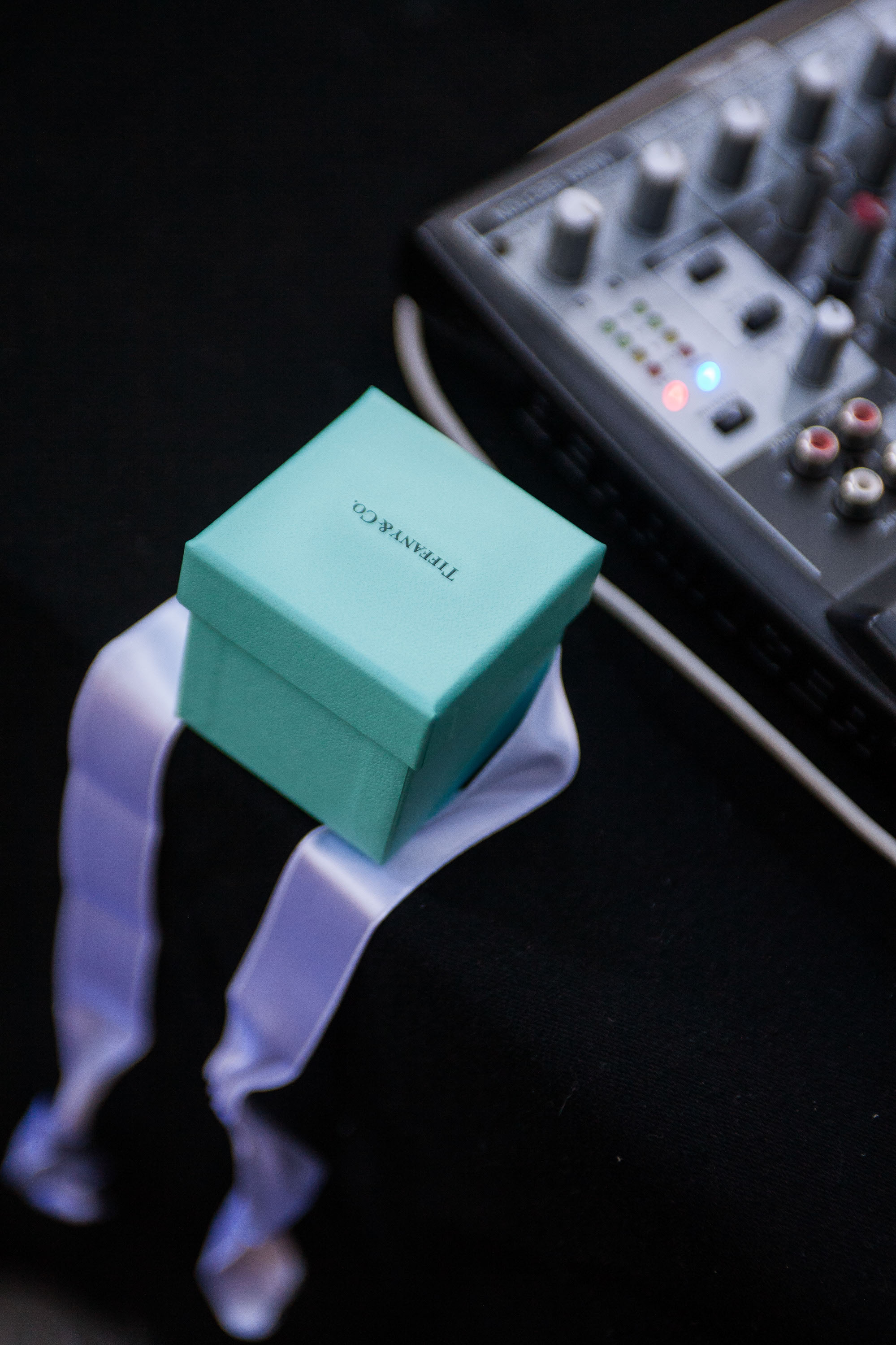 A Tiffany wedding ring waits on the DJ table at Pema Osel Ling in the Santa Cruz mountains