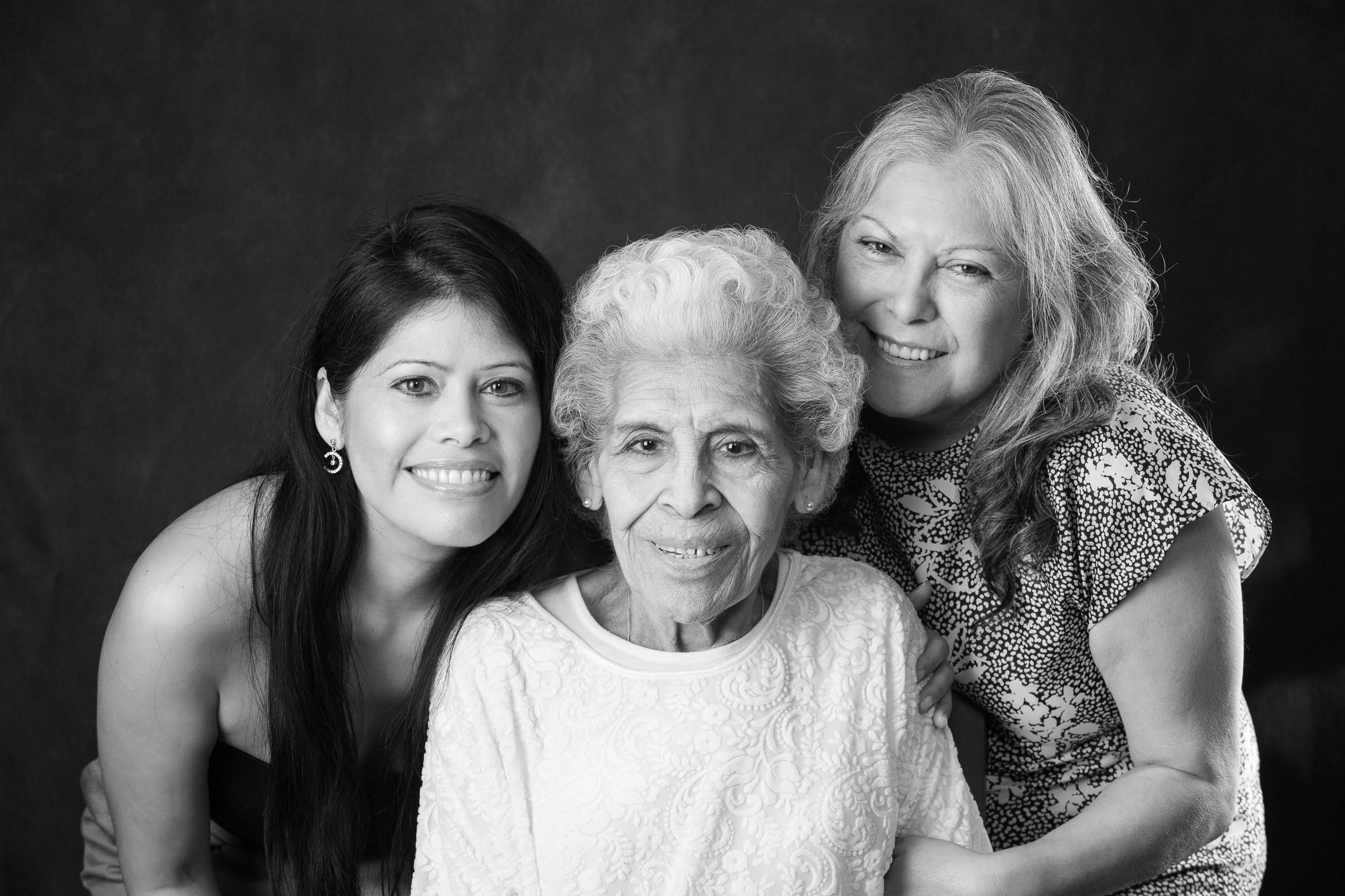 Three generations of women in a classic black and white portrait made in the Checkerbox Photography studio.