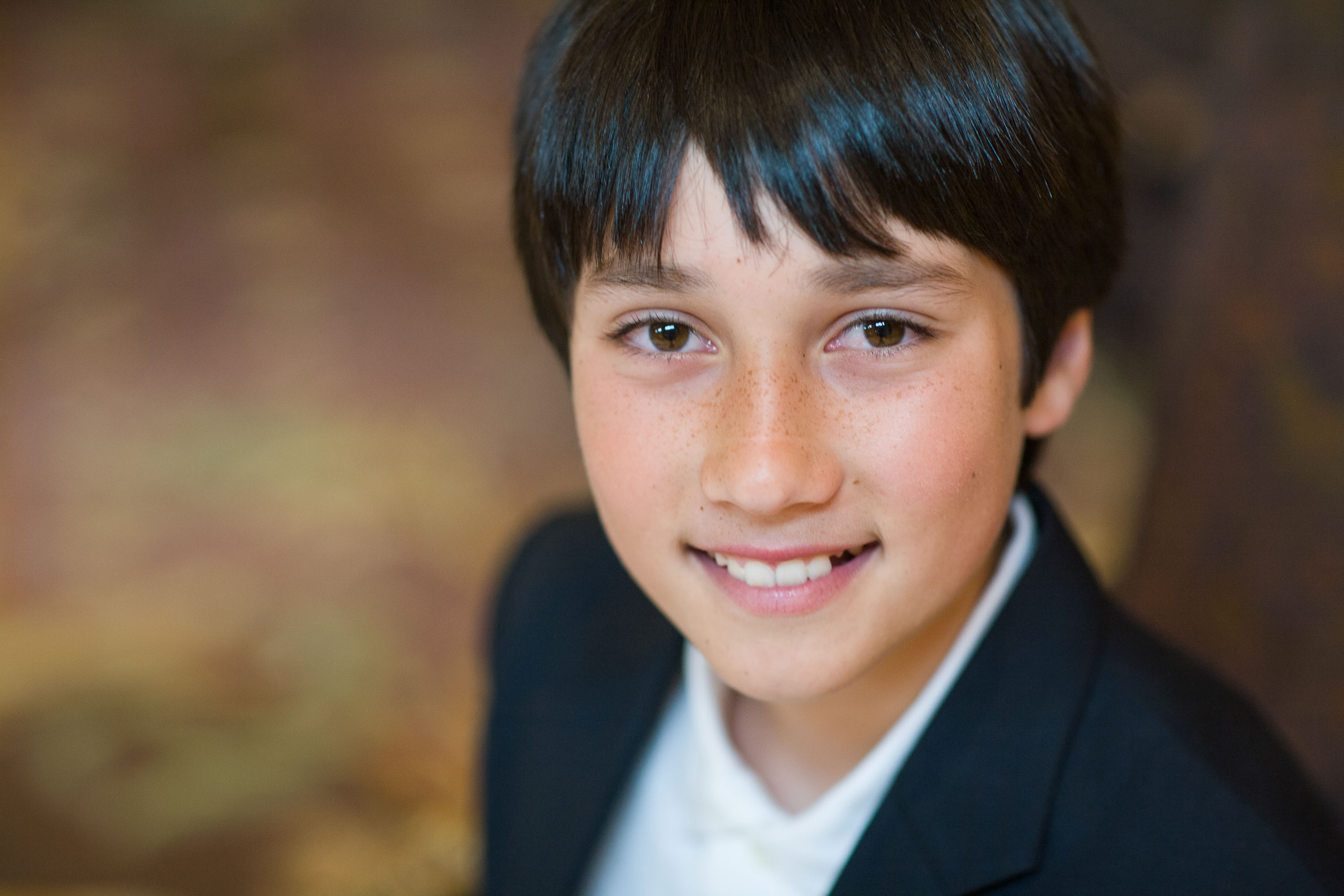 Close-up portrait of a smiling young man taken at the Fairmont Hotel.