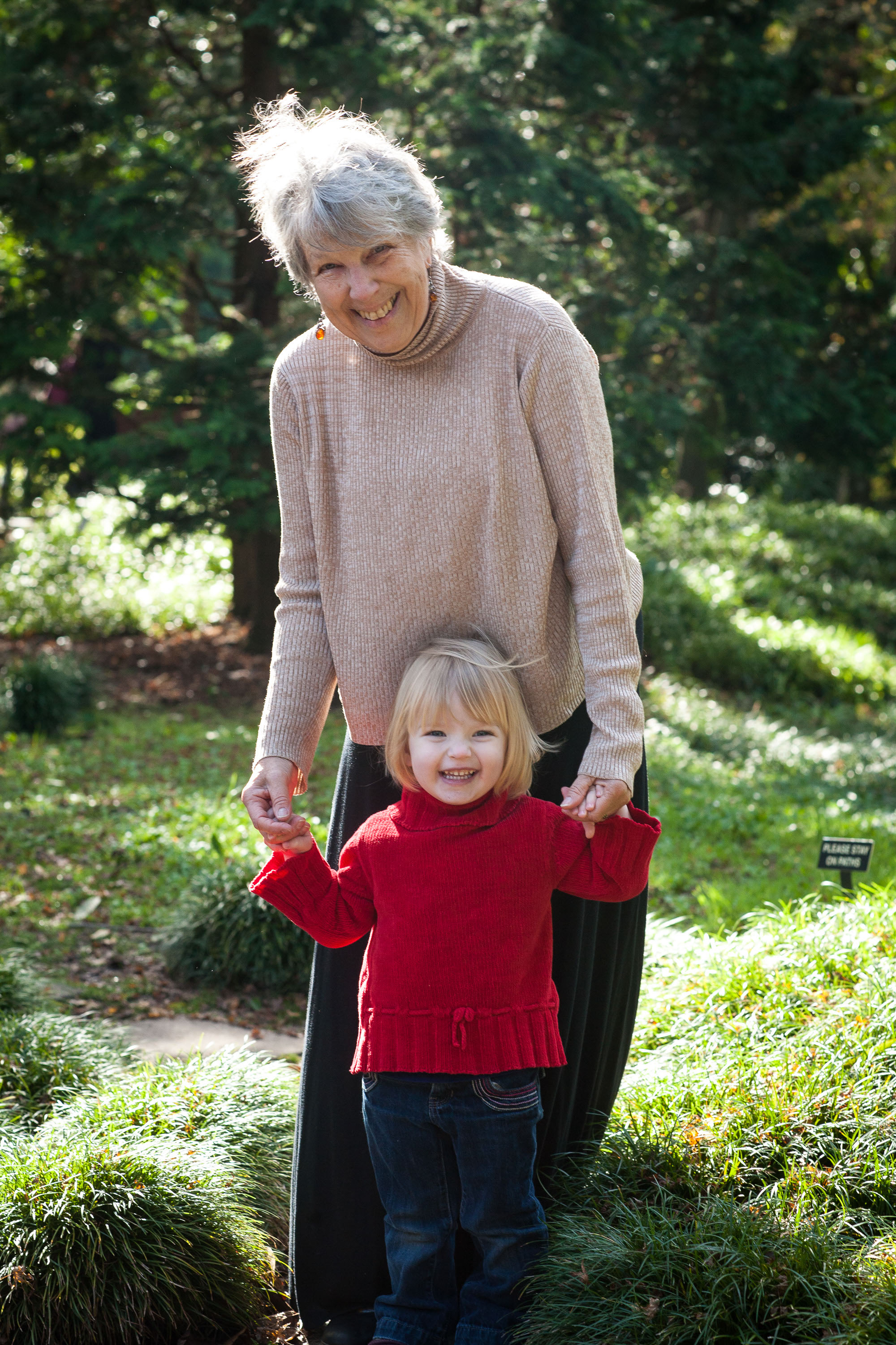 A grandma and her granddaughter in a sun-kissed portrait at the San Francisco Botanical Garden.