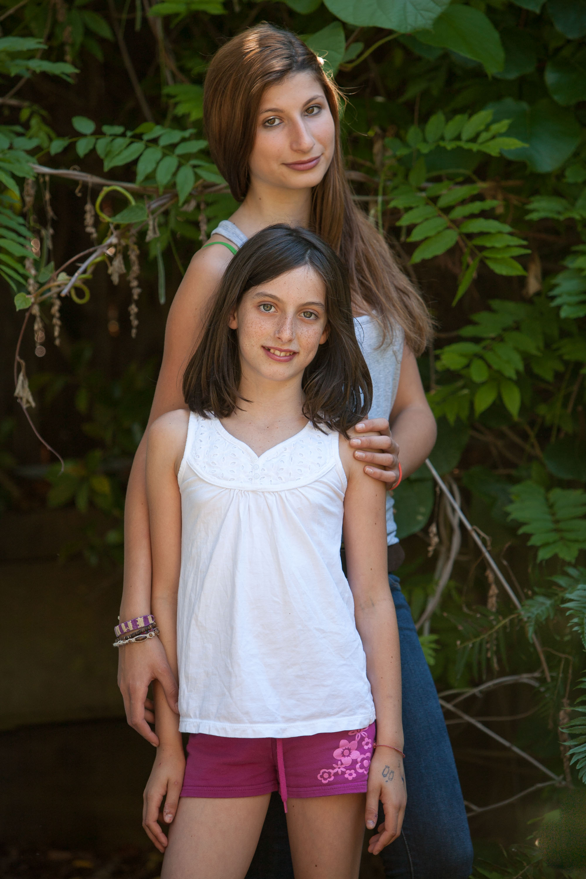 Sisters pose together in their Marin back yard.