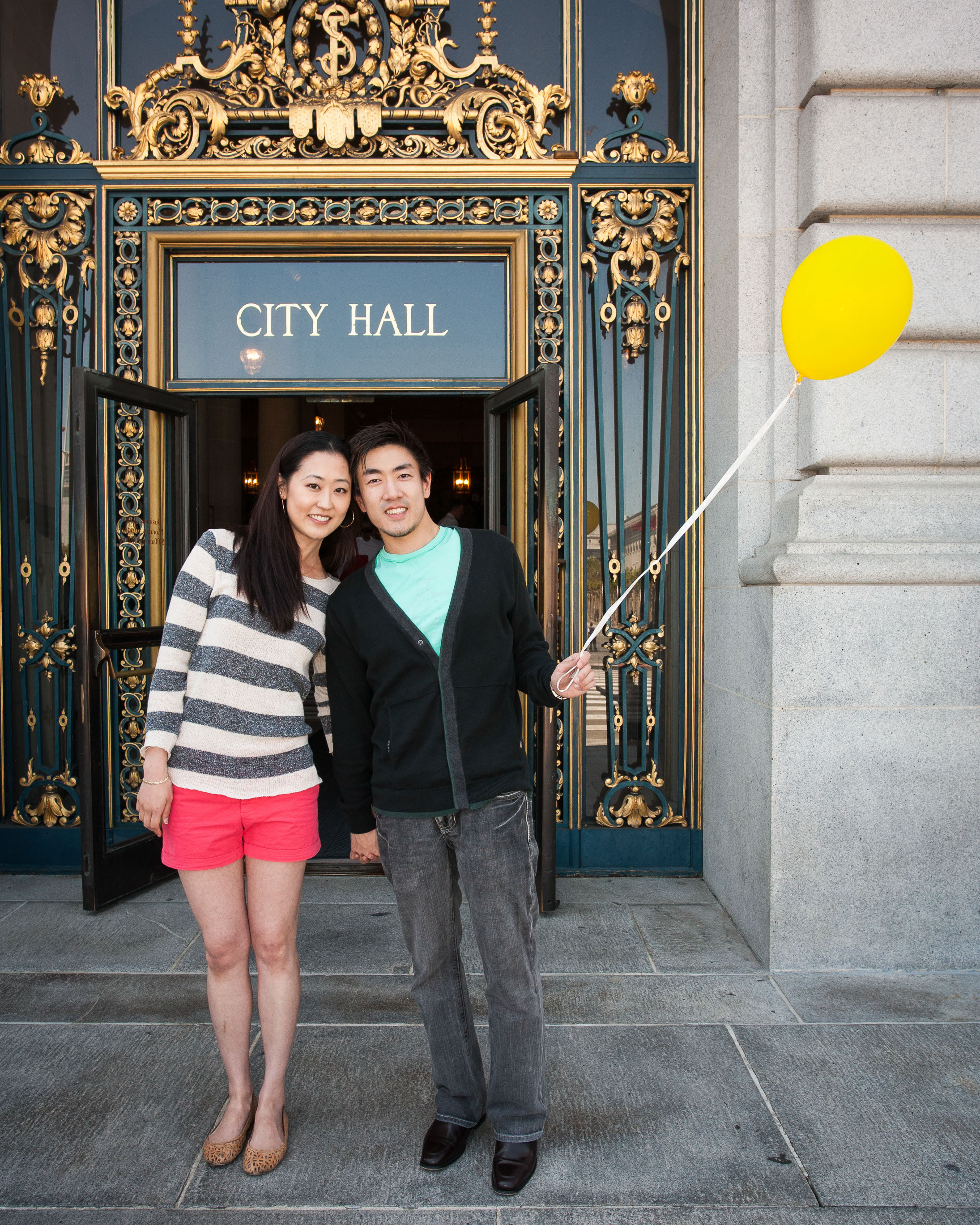 Cute couple stylin' it up in front of San Francisco City Hall, right before their wedding