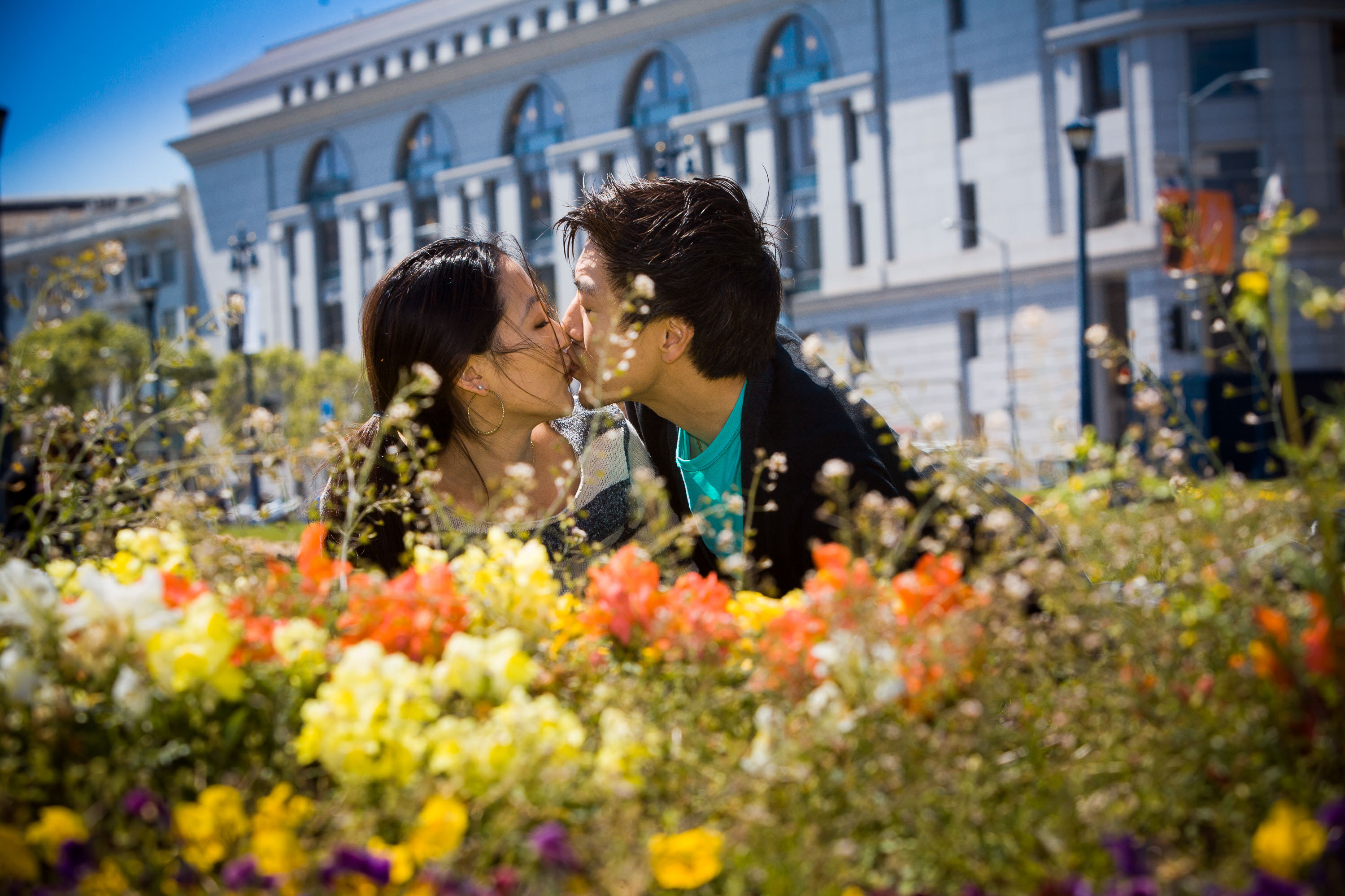 A kiss framed by flowers at a San Francisco City Hall wedding