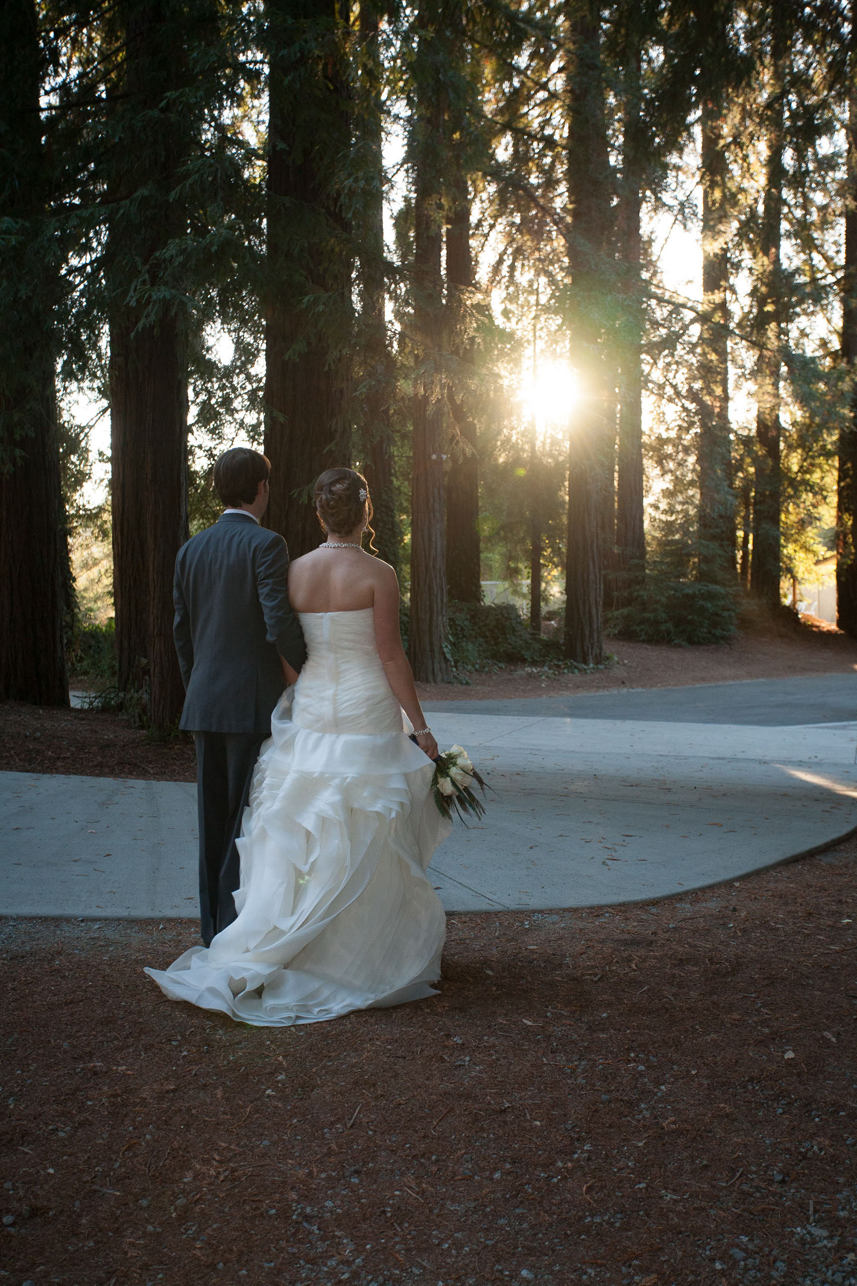 Bride in Vera Wang walks her man into the sunset arm in arm, at Pema Osel Ling Retreat Center in the Santa Cruz Mountains