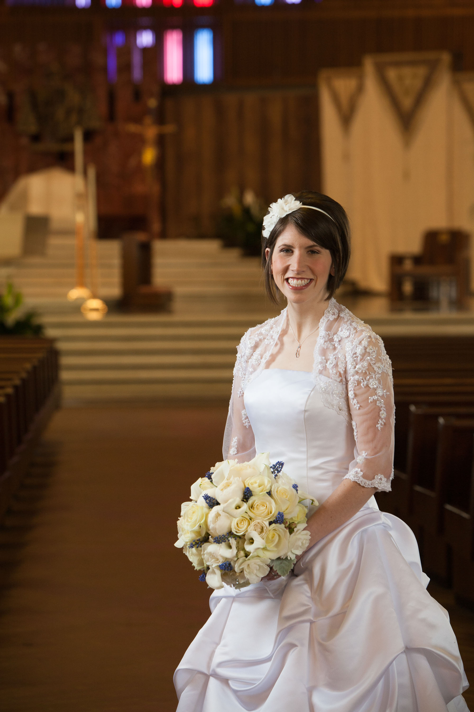 A beautiful 3/4 lenght portrait of the bride at St. Mary's Cathedral in San Francisco.