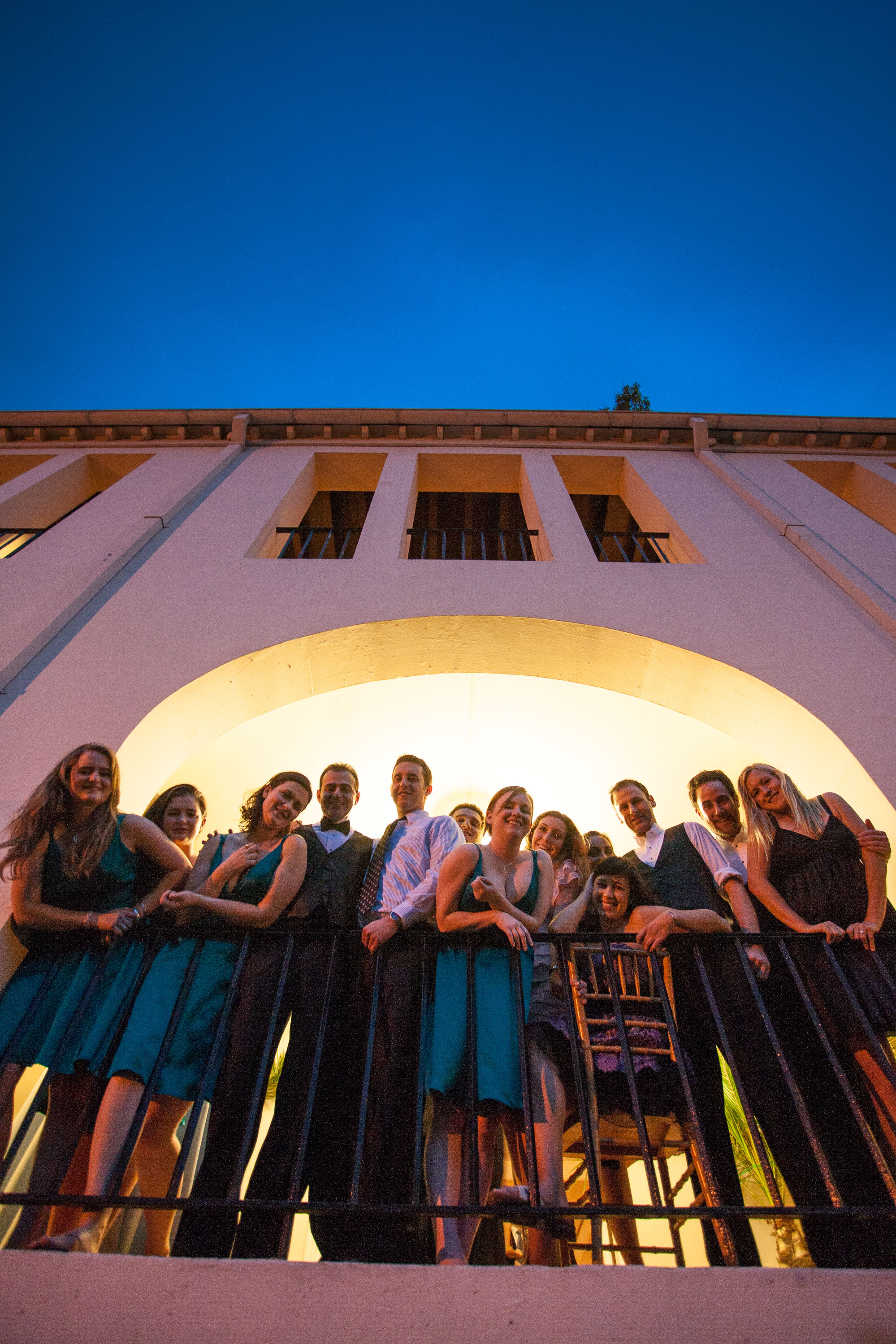 A dramatic twilight sky is the backdrop for a group of friends  at The San Francisco Film Centre